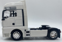 MAN TGX ciągnik siodłowy model WELLY 32650 metal 1:32 biały