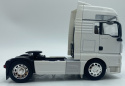 MAN TGX ciągnik siodłowy model WELLY 32650 metal 1:32 biały